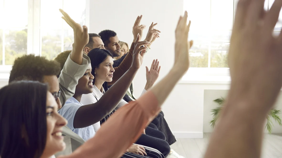 HVAC FAQs – Ogden, UT – Absolute Comfort Diverse adult crowd with raised hands and smiles