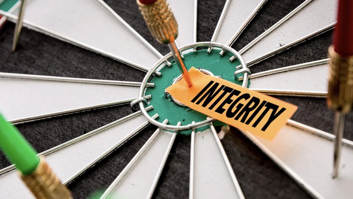 HVAC Core Values – Absolute Comfort – Ogden, Utah Dart board with “integrity” in bulls eye with dart through it