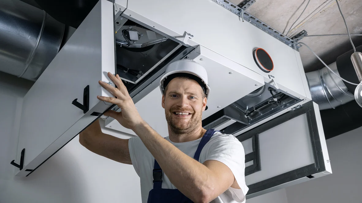 HVAC Professionals -- Ogden, UT -- Absolute Comfort Absolute Comfort heating and cooling technician smiling to camera