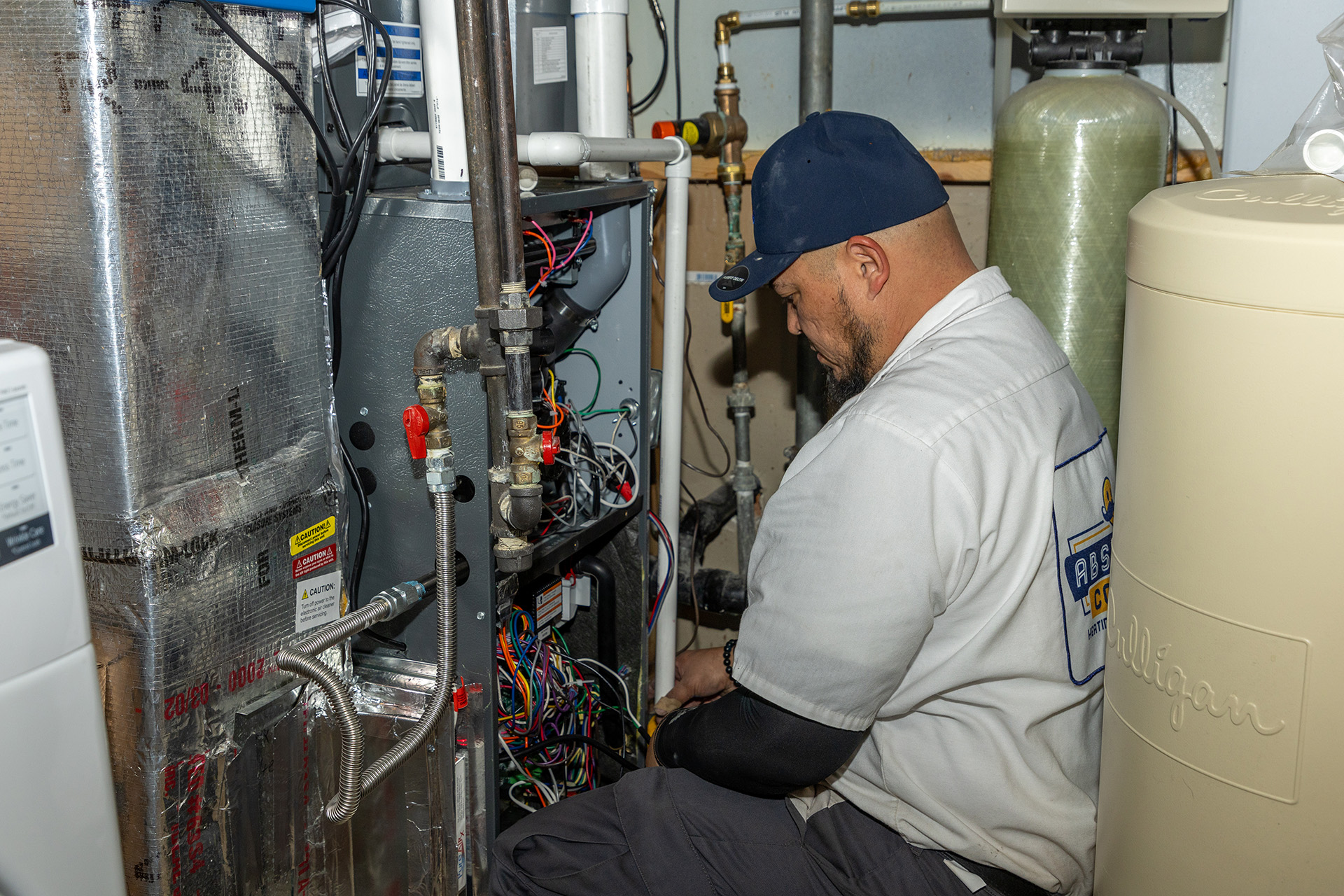 Absolute Comfort technician maintains Ogden HVAC system