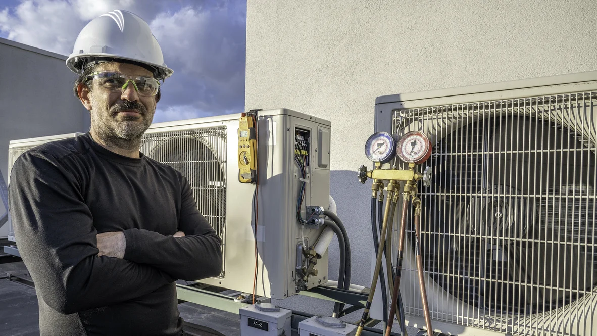 HVAC Accountability - Ogden, UT - Absolute Comfort Absolute Comfort HVAC technician stands confident with arms crossed